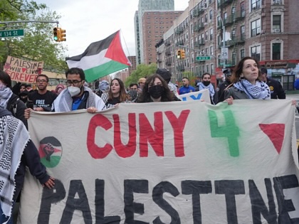 Pro-Palestinian demonstrators march from Columbia University to the City College of New York City on Thursday, April 30, 2026, marking the second anniversary of the occupation of Hamilton Hall at Columbia. Protesters hold a sign that reads "CUNY 4 Palestine."