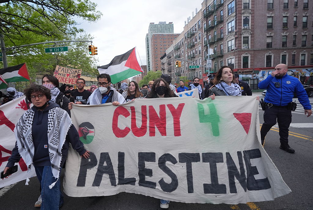 Pro-Palestinian demonstrators march from Columbia University to the City College of New York City on Thursday, April 30, 2026, marking the second anniversary of the occupation of Hamilton Hall at Columbia. Protesters hold a sign that reads "CUNY 4 Palestine."