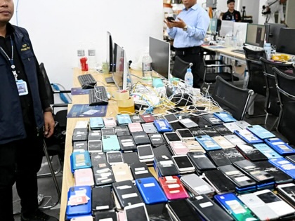 Image of a raid on a cyber scam operation center in Phnom Penh, Cambodia.