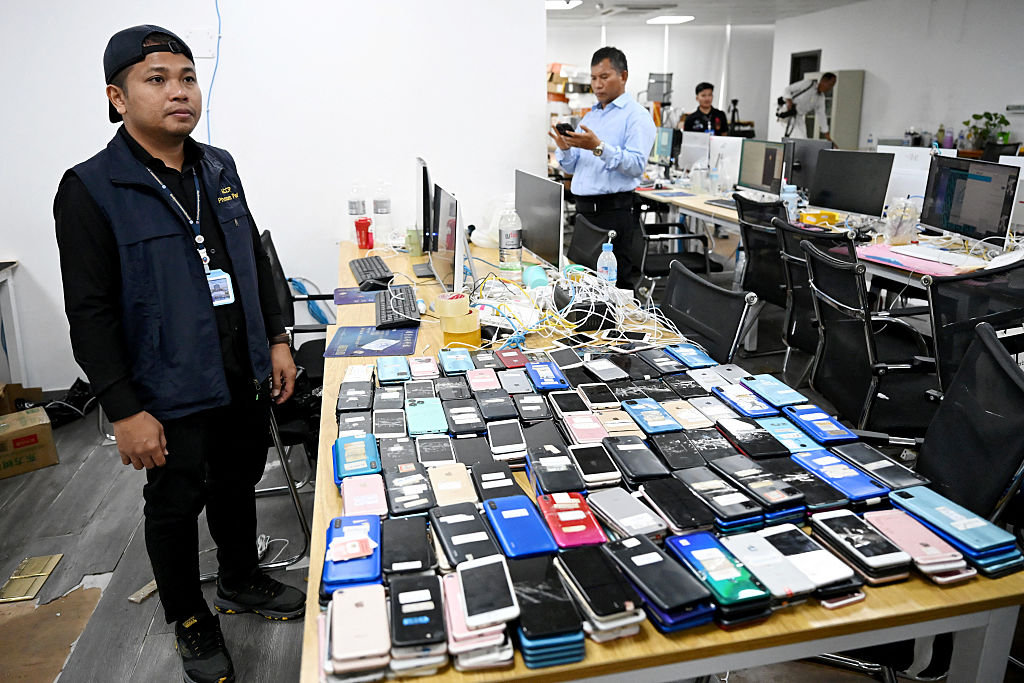 Image of a raid on a cyber scam operation center in Phnom Penh, Cambodia.