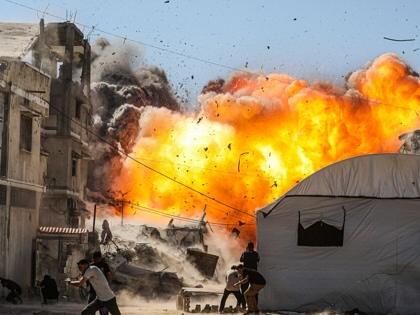 An unmanned aerial vehicle strike by the Israeli army targets several buildings on Industrial Street in western Gaza City, on July 12, 2026.