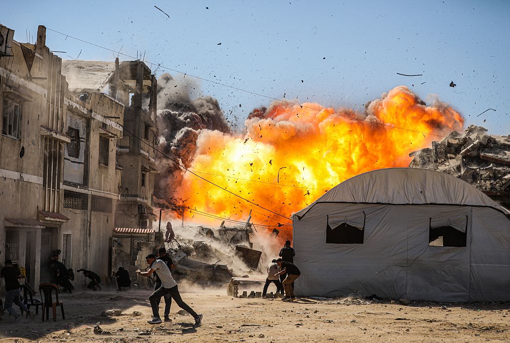 An unmanned aerial vehicle strike by the Israeli army targets several buildings on Industrial Street in western Gaza City, on July 12, 2026. 