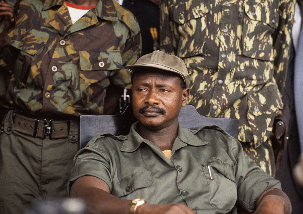 Ugandan President Yoweri Museveni sits flanked by guards shortly after seizing power in 1986.