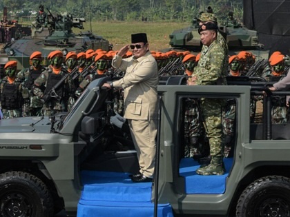 Indonesia's president, Prabowo Subianto, inspects troops from a vehicle during the Operational Troops and Military Honours ceremony at Suparlan Airfield, in Bandung, West Java, August 10, 2025.