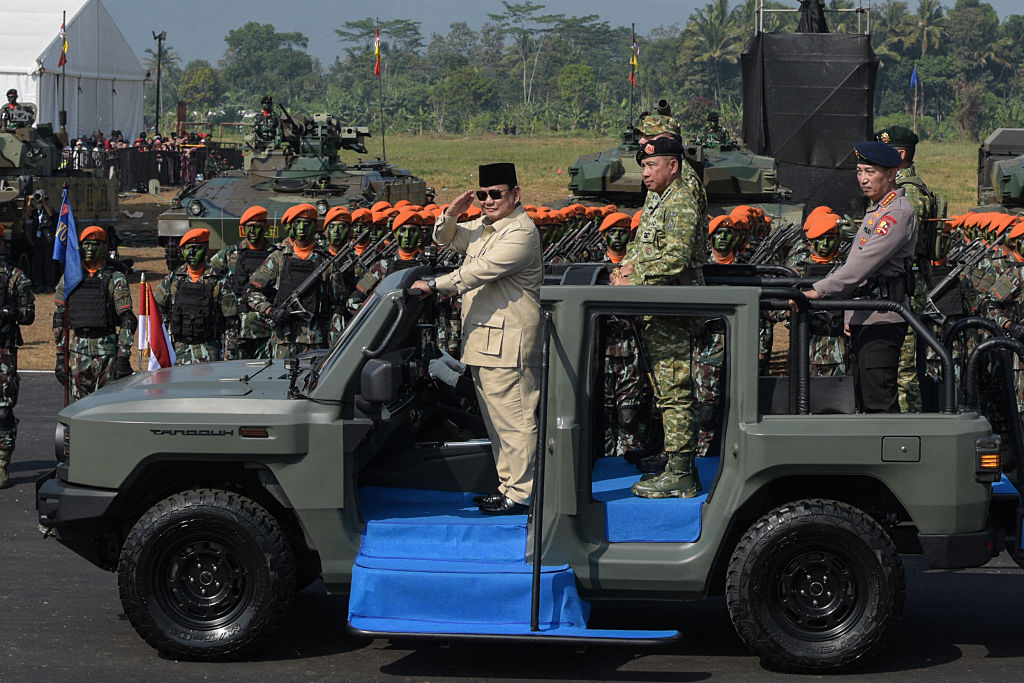 Indonesia's president, Prabowo Subianto, inspects troops from a vehicle during the Operational Troops and Military Honours ceremony at Suparlan Airfield, in Bandung, West Java, August 10, 2025.