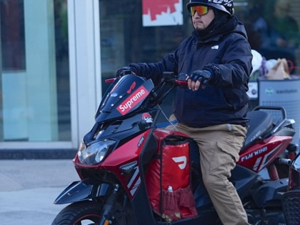 A DoorDash deliveryman on a motorcycle is seen in Queens, New York City, U.S., on May 7, 2026.