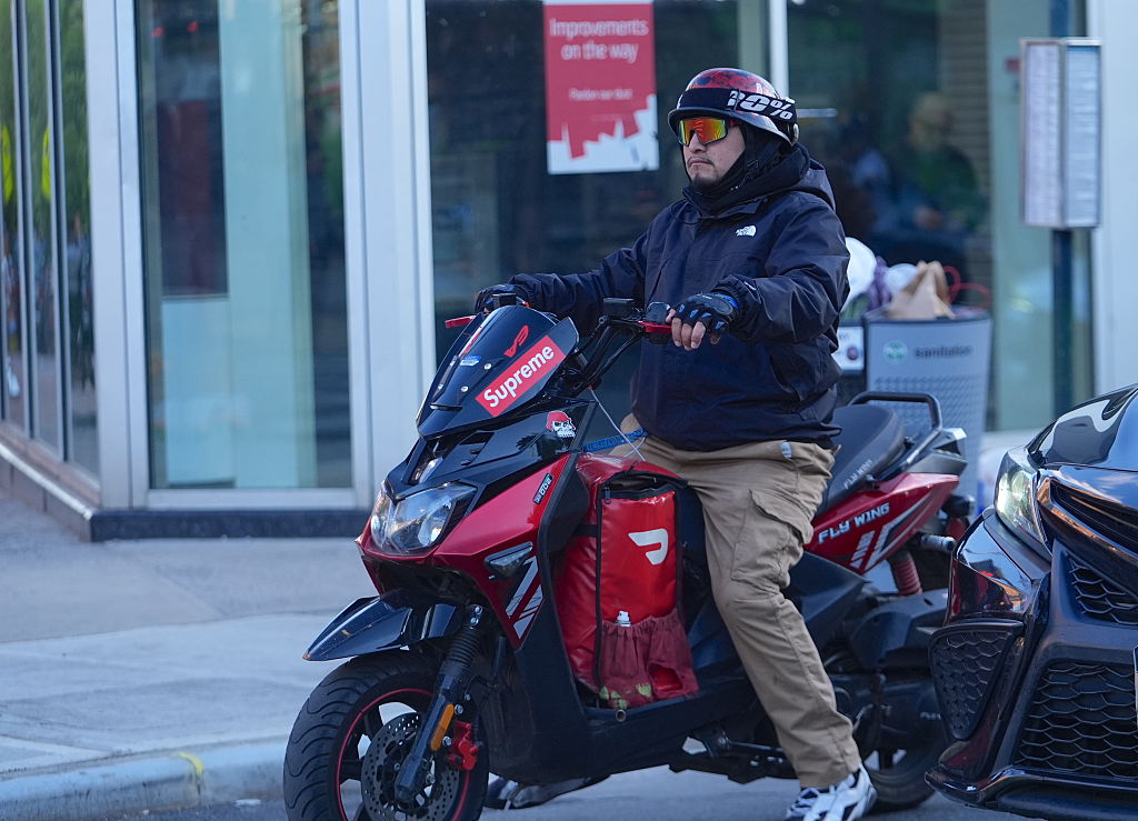 A DoorDash deliveryman on a motorcycle is seen in Queens, New York City, U.S., on May 7, 2026.