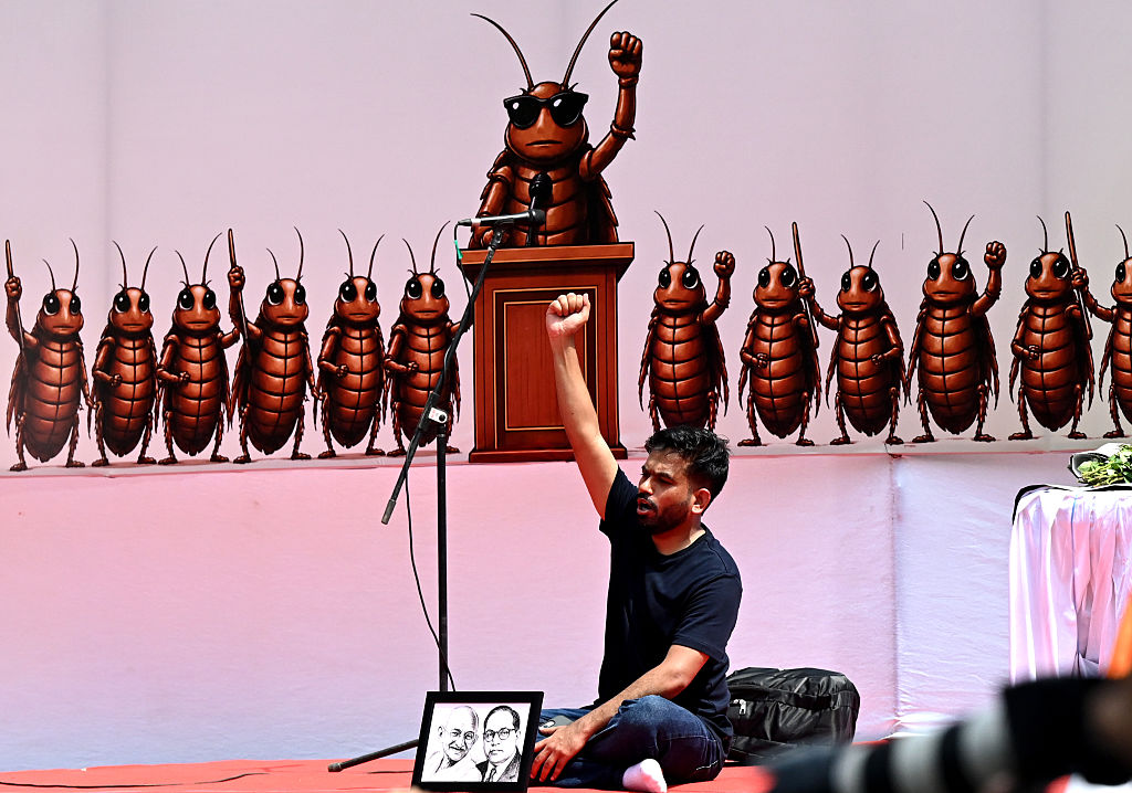 Cockroach Janata Party founder Abhijeet Dipke with his supporters during a protest seeking Union Education Minister Dharmendra Pradhan's resignation.