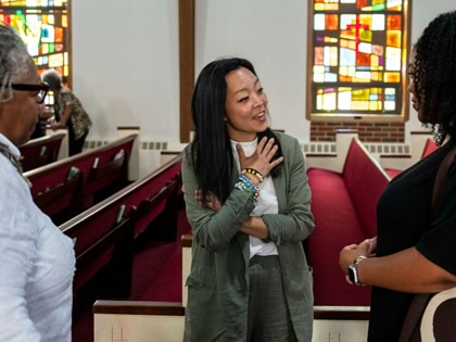 Francesca Hong meets parishioners at the St Paul Baptist Church in Racine, Wisconsin on July 19, 2026.