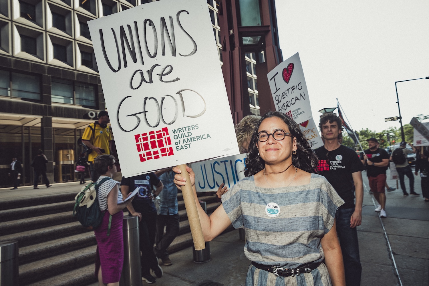 Claire Valdez pickets with WGAE workers.