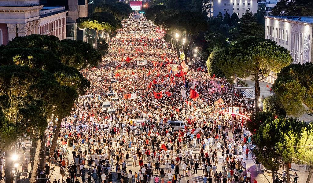 A drone view shows thousands of demonstrators gathered in central Tirana during the thirty-fifth consecutive day of protests against a proposed luxury tourism development project linked to international investors, including Jared Kushner, in Tirana, Albania, on July 4, 2026.