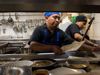 Dishwashers Esteban Soc, left, and Joselino Aguilar, right, at work in the kitchen of Mexican restaurant Caracol in Houston, Texas, on July 12, 2017.