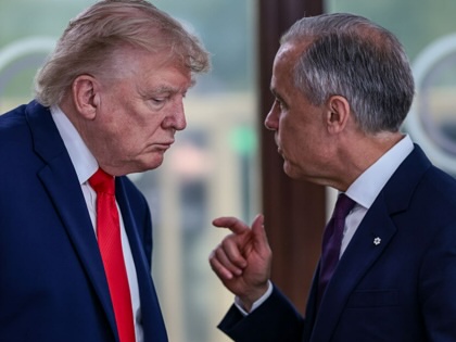 Donald Trump speaks with Mark Carney at a working lunch with leaders of G7 on June 16, 2026, in Évian-les-Bains, France. 