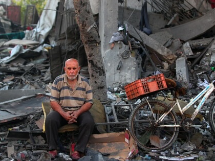 A Palestinian man rests amid debris at the site of an Israeli strike on a house in Gaza City, on July 30, 2026. 