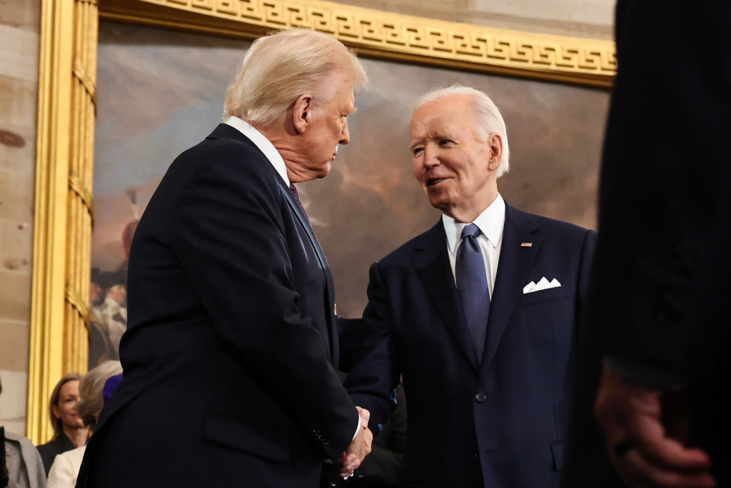 Donald Trump greets Joe Biden as he arrives for inauguration ceremonies in the Rotunda of the US Capitol on January 20, 2025.