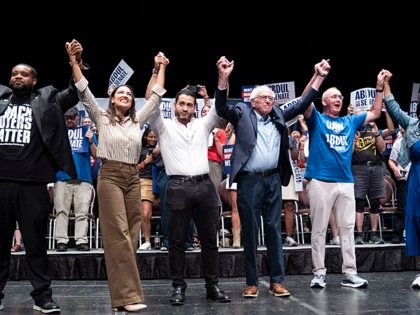 Michigan State Rep. Donavan McKinney, U.S. Rep. Alexandria Ocasio-Cortez (D-NY), Michigan Democratic candidate for Senate Abdul El-Sayed, U.S. Sen. Bernie Sanders (I-VT), U.A.W. President Shawn Fain and Congresswoman Rashida Tlaib greet the crowd after El-Sayed spoke at The People V. The Powerful rally at the Detroit Opera House on July 18, 2026 in Detroit, Michigan. Sanders, Ocasio-Cortez and others joined El-Sayed to rally the crowds.
