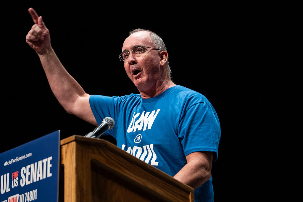 UAW President Shawn Fain speaks at The People V. The Powerful rally at the Detroit Opera House on July 18, 2026, in Detroit, Michigan.