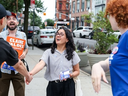 State Representative Claire Valdez, a Democrat from New York and US House candidate, center, speaks with voters outside a polling location at PS 84 during a primary election in New York City on Tuesday, June 23, 2026.