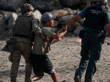 Migrants arriving to Tarajal beach after crossing the border between Spain and Morocco on July 31, 2026, in Ceuta, Spain.