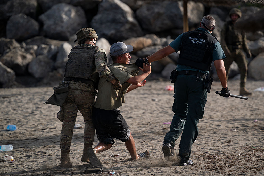 Migrants arriving to Tarajal beach after crossing the border between Spain and Morocco on July 31, 2026, in Ceuta, Spain.