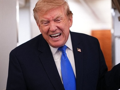 Donald Trump speaks to the press aboard Air Force One on August 2, 2026. 
