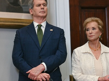 Linda McMahon and Scott Bessent listen after the signing an executive order restarting the Presidential Fitness Test in public schools at the White House on July 31, 2025.