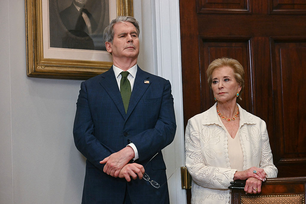 Linda McMahon and Scott Bessent listen after the signing an executive order restarting the Presidential Fitness Test in public schools at the White House on July 31, 2025.