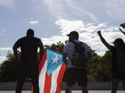 Protesters block a main highway during the demonstration to demand the resignation of Puerto Rico's Governor Ricardo Rossello on July 22, 2019, in San Juan, Puerto Rico.