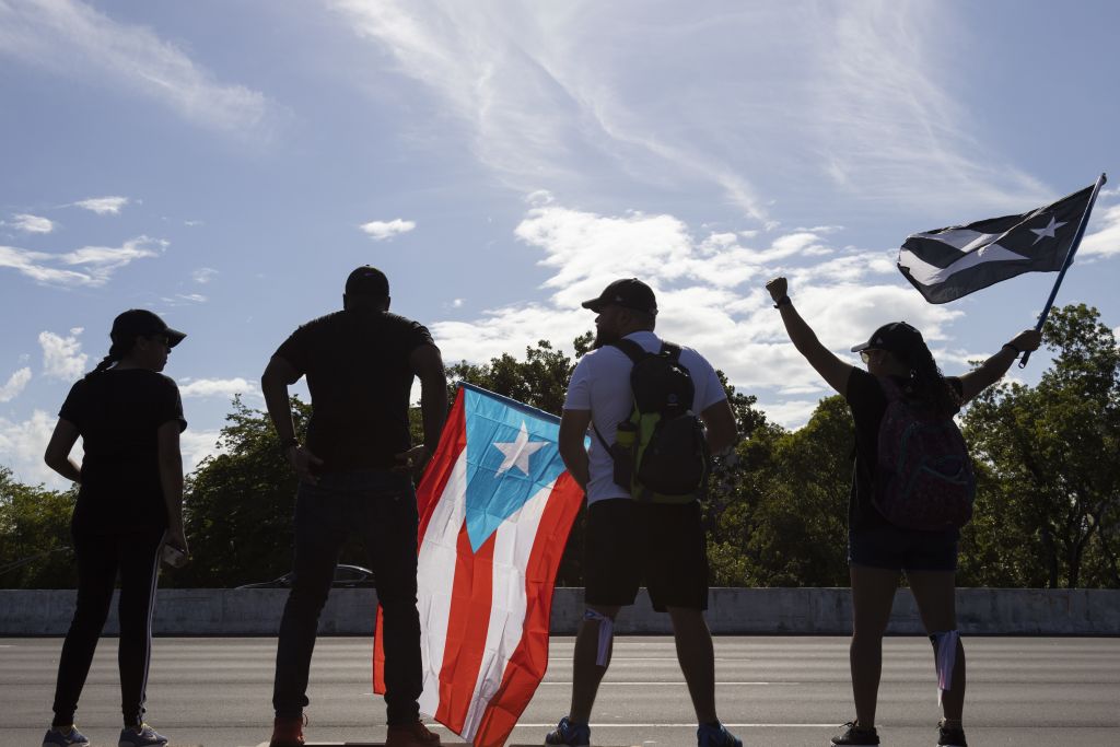 Protesters block a main highway during the demonstration to demand the resignation of Puerto Rico's Governor Ricardo Rossello on July 22, 2019, in San Juan, Puerto Rico. 