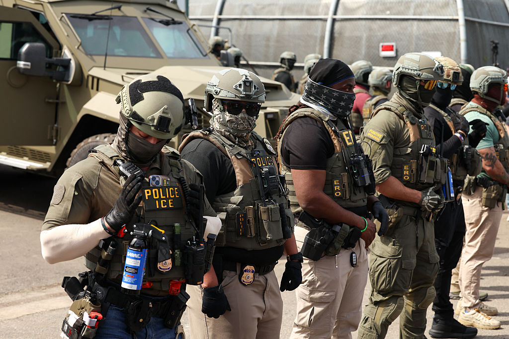 ICE agents stand guard as protesters gather at Delaney Hall in Newark, New Jersey, on May 26, 2026.