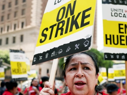 Hotel workers with Unite Here Local 11 picket outside the InterContinental hotel on the first day of a strike by union members at many major hotels in Southern California on July 2, 2023, in Los Angeles, California.