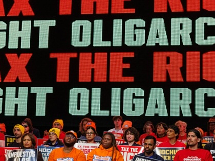 People attend a Tax The Rich rally hosted by the Democratic Socialists of America at Lehman College in the Bronx, New York, on March 29, 2026.