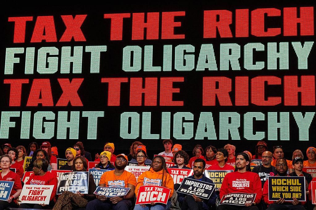 People attend a Tax The Rich rally hosted by the Democratic Socialists of America at Lehman College in the Bronx, New York, on March 29, 2026.