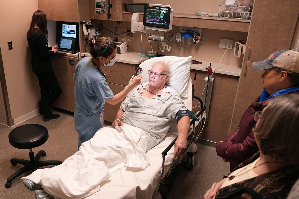 Dr Alison Raffman, a medical resident at HCMC who is spending one month doing rural ER care at Sanford Bemidji Medical Center, examines Jack Stomberg as his family looks on Wednesday, Feb. 12, 2025 in Bemidji, Minn.