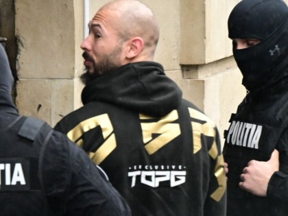 Andrew Tate is led by police officers into the Court of Appeal building in Bucharest, Romania, on March 12, 2024.