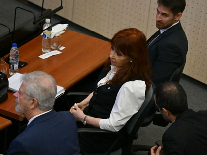 Former Argentine President Cristina Fernández de Kirchner sits next to her lawyer at the Comodoro Py courthouse in Buenos Aires on March 17, 2026. 