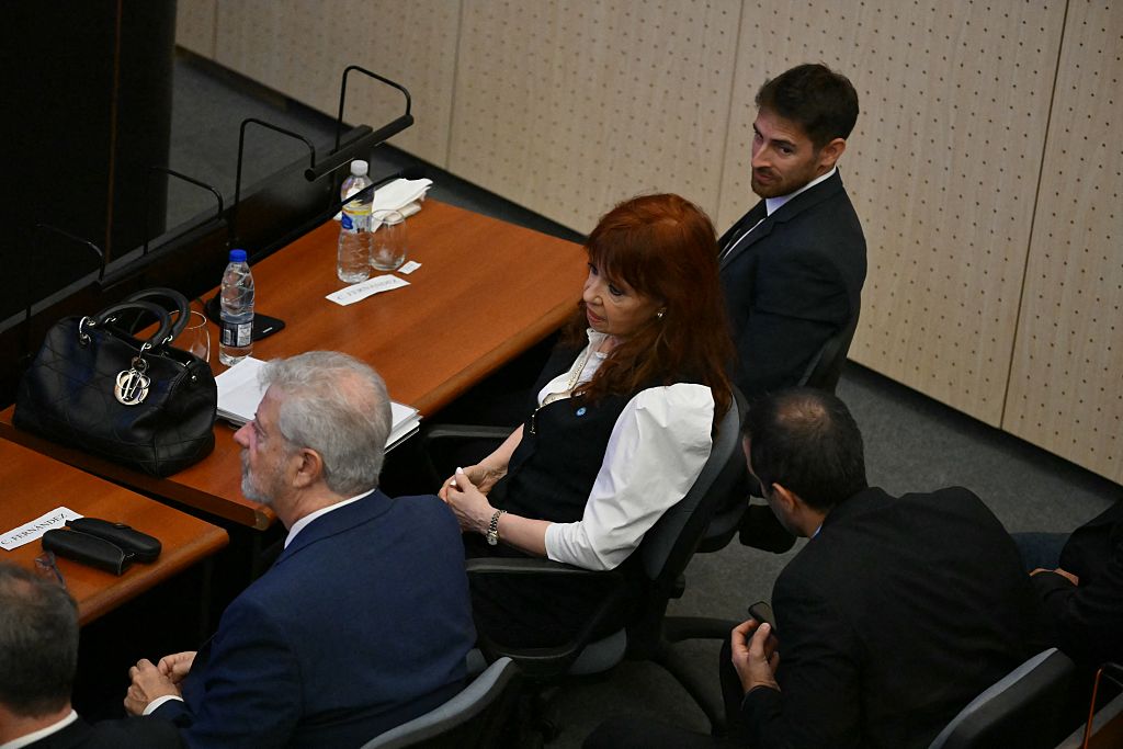 Former Argentine President Cristina Fernández de Kirchner sits next to her lawyer at the Comodoro Py courthouse in Buenos Aires on March 17, 2026.