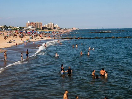 People cool off at Coney Island beach on June 29, 2026, in the Brooklyn borough of New York City.
