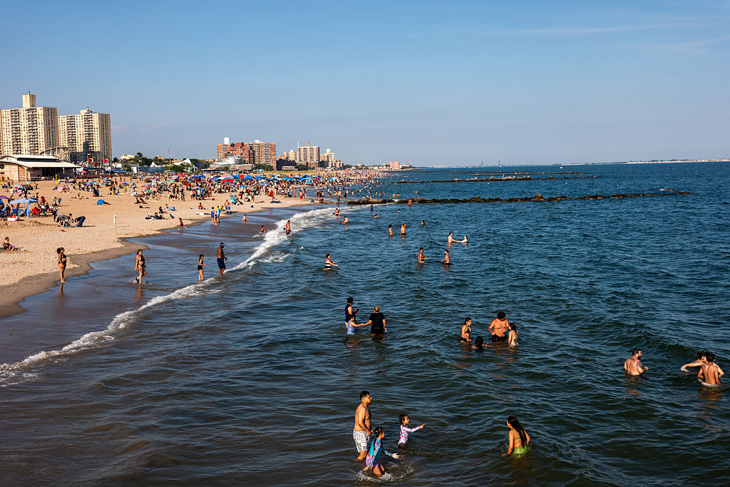 People cool off at Coney Island beach on June 29, 2026, in the Brooklyn borough of New York City.