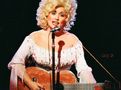Dolly Parton performs on stage at the Dominion Theatre on March 29th, 1983, in London, United Kingdom.