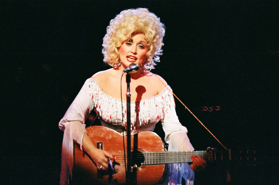 Dolly Parton performs on stage at the Dominion Theatre on March 29th, 1983, in London, United Kingdom.