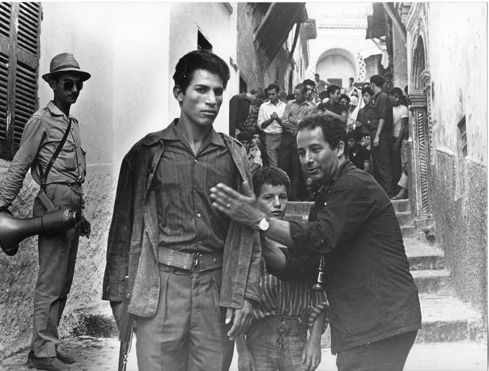 A production still from La Bataille d'Alger, featuring director Gillo Pontecorvo and lead actor Brahim Hadjadj.