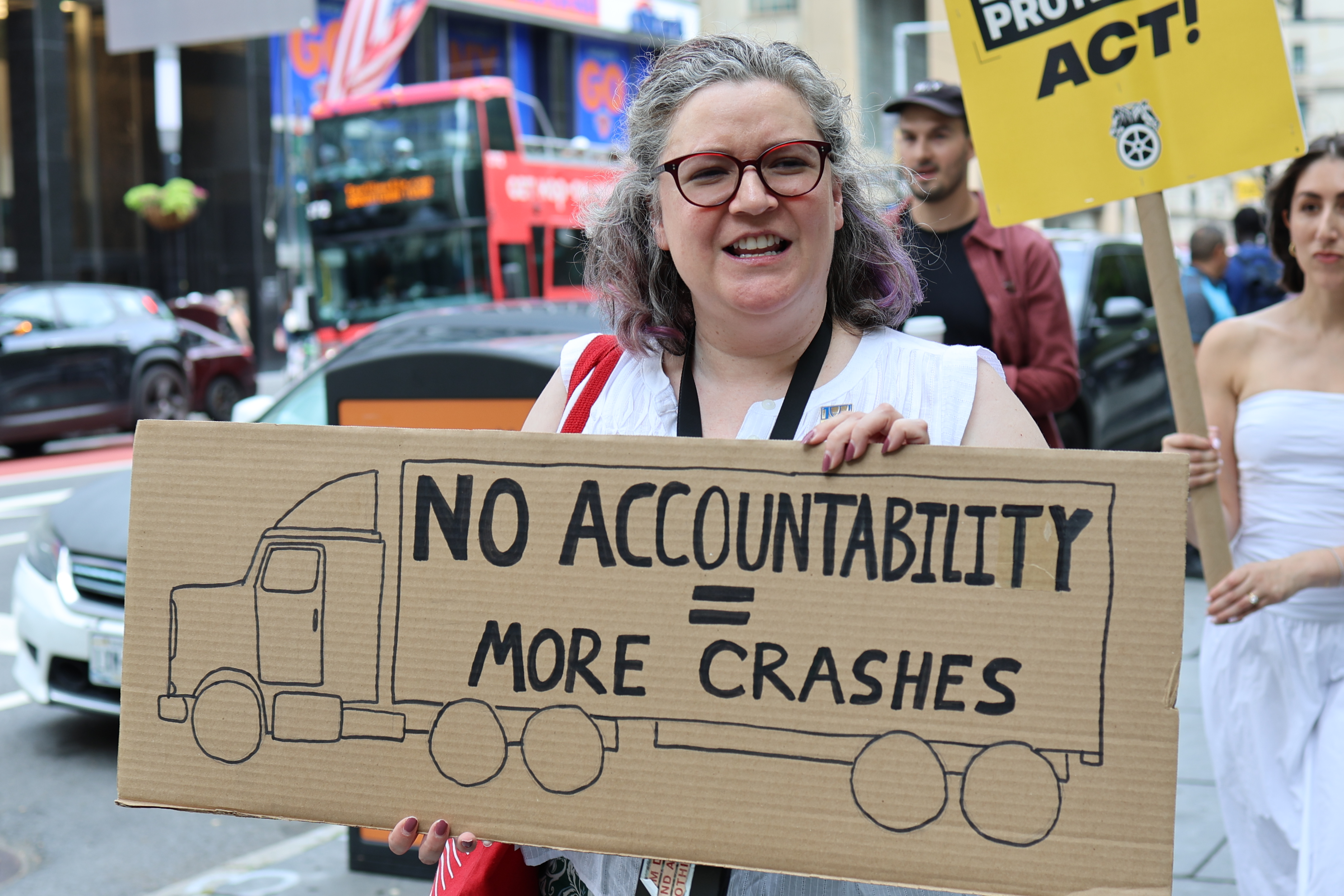 Teamsters and local activists rally outside New York City Hall in support of the Delviery Protection Act.