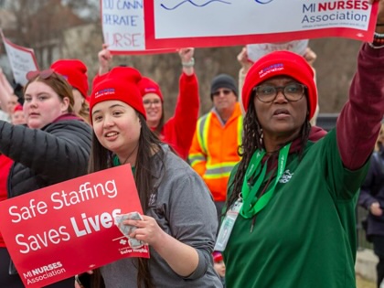 Members of the Michigan Nurses Association rally as their union contract at McLaren Lapeer Region Hospital is about to expire.