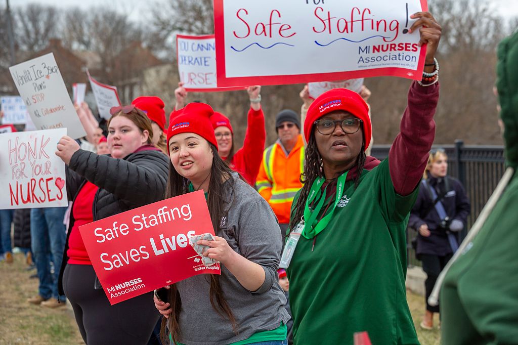 Members of the Michigan Nurses Association rally as their union contract at McLaren Lapeer Region Hospital is about to expire.