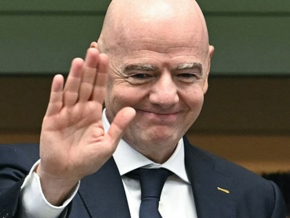 FIFA President Gianni Infantino gestures from the stands ahead of the World Cup semifinal match between France and Spain in Arlington, Texas, on July 14, 2026.