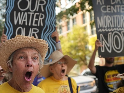 Marcia Hermann chants during a protest against data center development outside the Austin Marriott Downtown on Wednesday, Sept. 2, 2026, in Austin, Texas.
