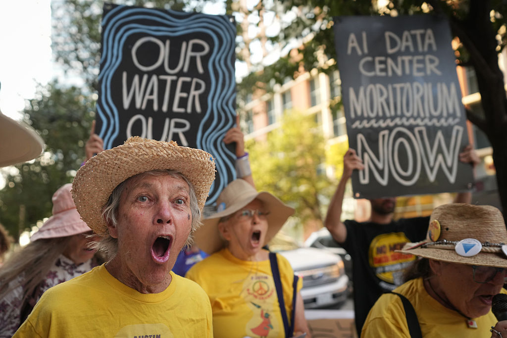 Marcia Hermann chants during a protest against data center development outside the Austin Marriott Downtown on Wednesday, Sept. 2, 2026, in Austin, Texas.