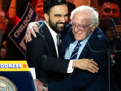 Zohran Mamdani and Bernie Sandersembrace during a One Hundred Days rally in the Queens borough of New York, on April 12, 2026.