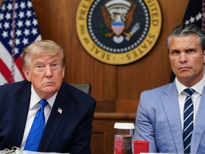 Donald Trump and Pete Hegseth listen to questions from the press during a Cabinet meeting at Camp David in Maryland, on July 31, 2026. 